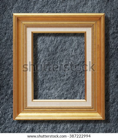 gold frame on Dark grey black slate background or texture.