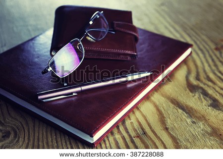 business pen glasses notebook