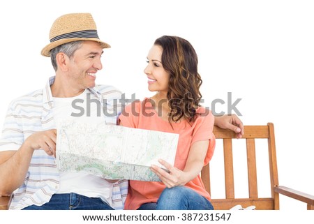 Couple on bench looking at map on white background