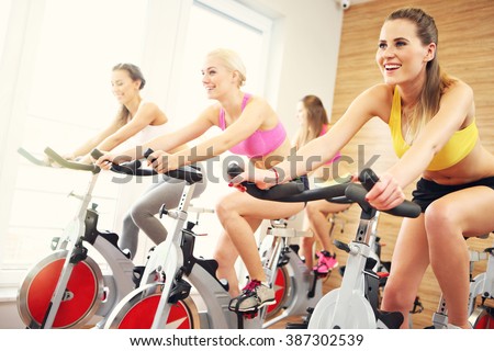 Picture of sporty group of women on spinning class Royalty-Free Stock Photo #387302539