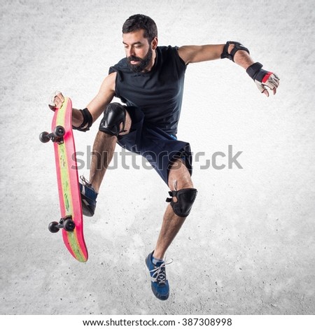 Man with skateboard jumping