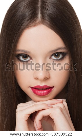 Portrait of a young charming brunette makeup beauty.