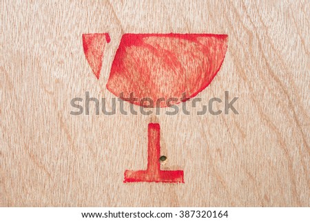  image  of fragile symbol on wood board