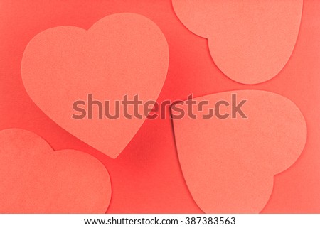 Multiple red hearts on red background