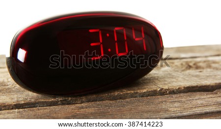 Digital clock on wooden table