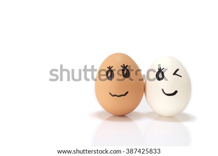 white and brown egg couple in the white