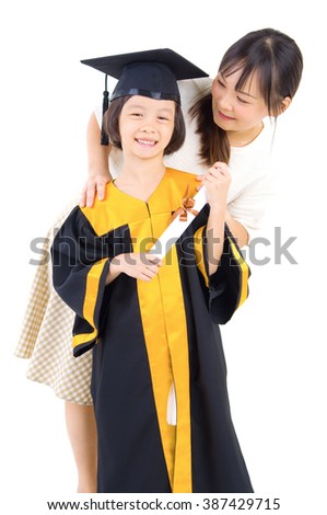 Asian daughter in graduation gown.Taking photo with her mother.