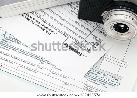 Camera on tax form background