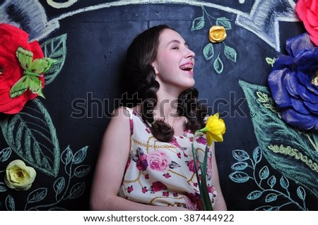 the girl on the background paper flowers