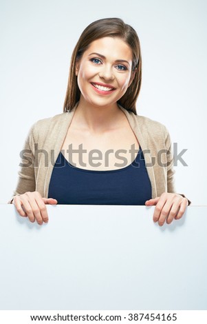 Casual dressed young woman standing with blank sign board. White background isolated.