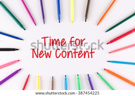 Time For New Content written on white background with multi colored pen 