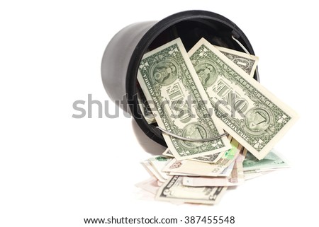 black plastic bucket filled with money isolated on white