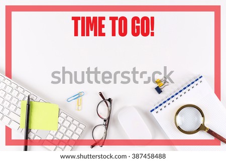 High angle view of various office supplies on desk with a word TIME TO GO