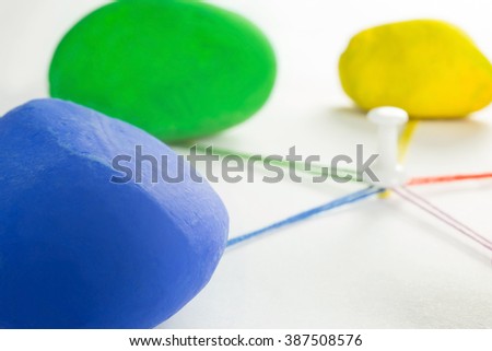 stones of different colors that come together with the colored wires
