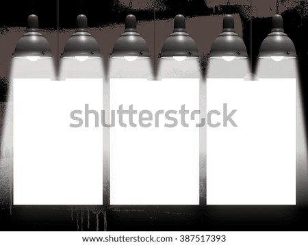 Close-up of three hanged paper sheet frames with clips on brown paint stroke brush on black background