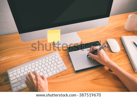 Designer working using computer vintage color