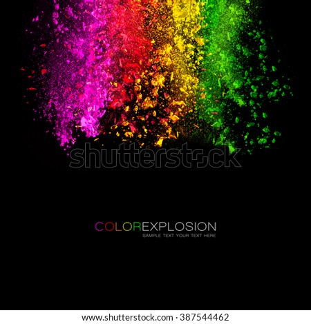 Falling colored powder. Rainbow of pink, red, orange, yellow and green dust over black background. Template design with sample text