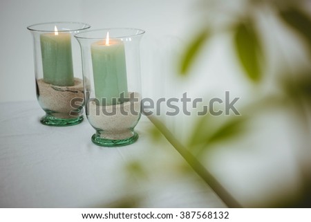 View of candles on a table Royalty-Free Stock Photo #387568132