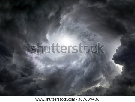 Light in the Dark and Dramatic Storm Clouds Royalty-Free Stock Photo #387639436