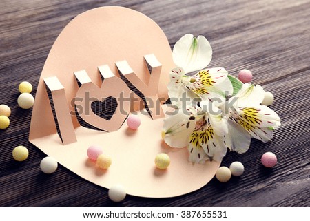 Valentine's Day concept. Beautiful gift card with flowers, close up