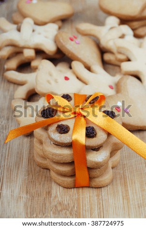 A stack of homemade cookies with a bow