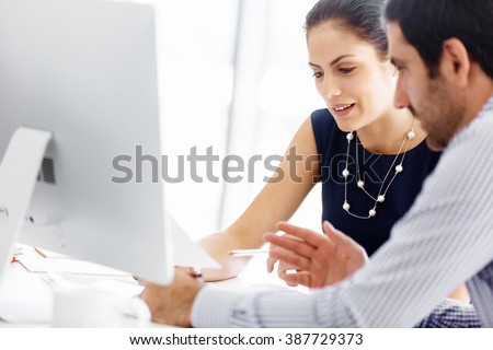 Business people in modern office Royalty-Free Stock Photo #387729373