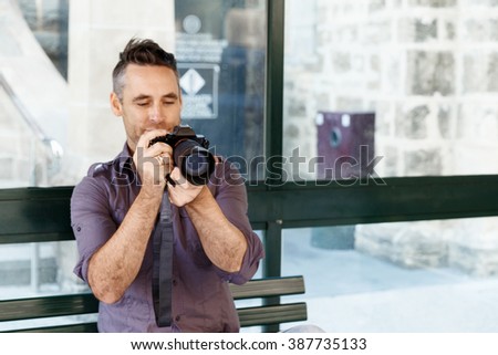Male photographer taking picture