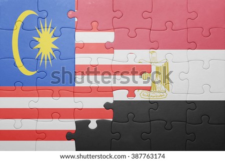 puzzle with the national flag of malaysia and egypt. concept