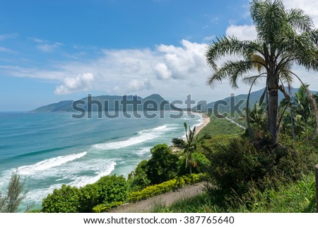 Armacao beach in Florianopolis, Santa Catarina, Brazil. One of the main tourists destination in south region. Royalty-Free Stock Photo #387765640