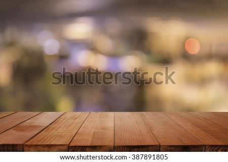 Empty brown wooden table and blur background of resturant lights ,can be used for montage or display your products with copy space ,business concept
  Royalty-Free Stock Photo #387891805