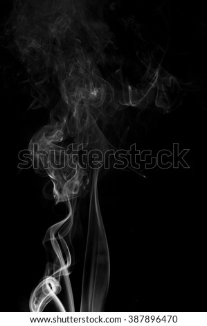 movement of smoke white on black background ink beautiful b w