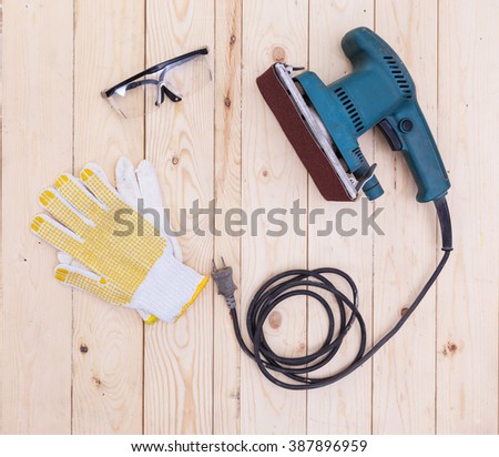 polishing machines with glove and Splinter glasses on wood table