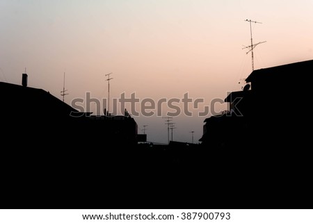 silhouette of building at market with sunset background