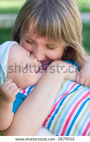 Happy Mummy hug her little son