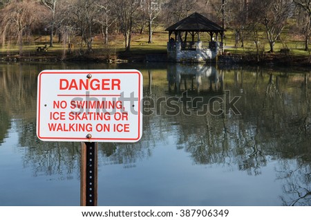 Danger sign warning people for swimming and ice related recreational activities at the Duck Pond in Virginia Tech college, Blacksburg