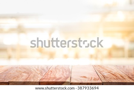 Empty of wood table top  with abstract light gold  background.for montage product display/presentation