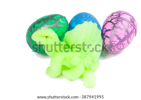 Toy Dinosaur egg for Easter isolate on white