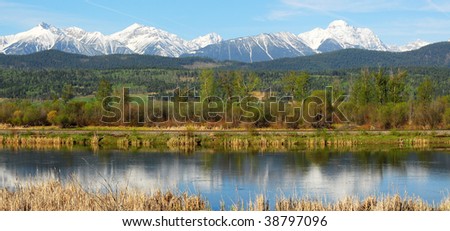Spring panorama of the canadian rocky mountains and river in radium hot springs, british columbia, canada Royalty-Free Stock Photo #38797096