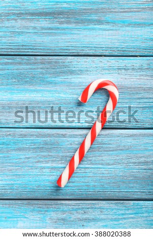 Christmas candy can on a blue wooden table
