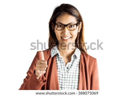 Smiling businesswoman showing a thumbs up on white background