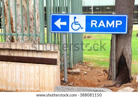 Wheelchair ramp sign and arrow left for handicapped people, Australia