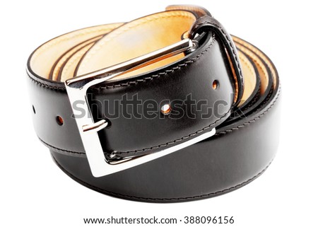 belt twisted into a ring on a white background