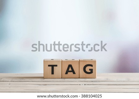 Tag made of wooden cubes on a table