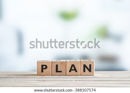 Plan word on wooden cubes on a table
