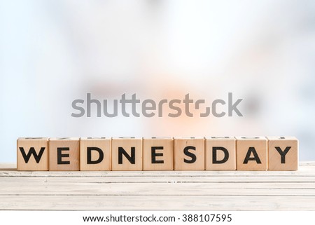 Wednesday sign with wooden cubes on a table