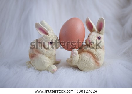 Play rabbit egg white background.