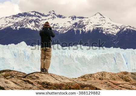 Man taking picture of Perito Mereno Glacier