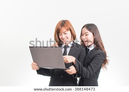 Two Asian women using laptop, isolate on white background.