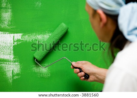 green dye and roller building interior active nails activity hand people wall home paint human action man house male repair indoor cleaning art construction mansion graphic internal residence working