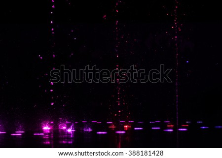 colorful water shape on fountain with black background